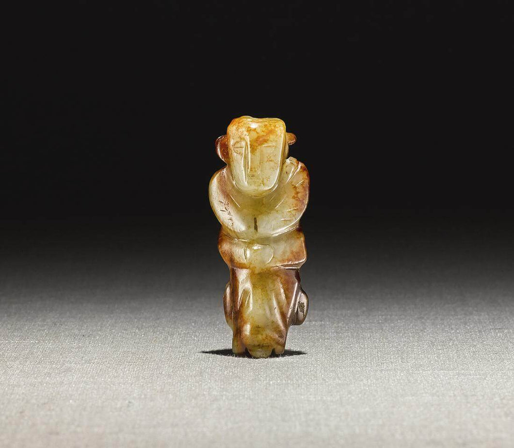 A Yellow and Russet Jade Figure