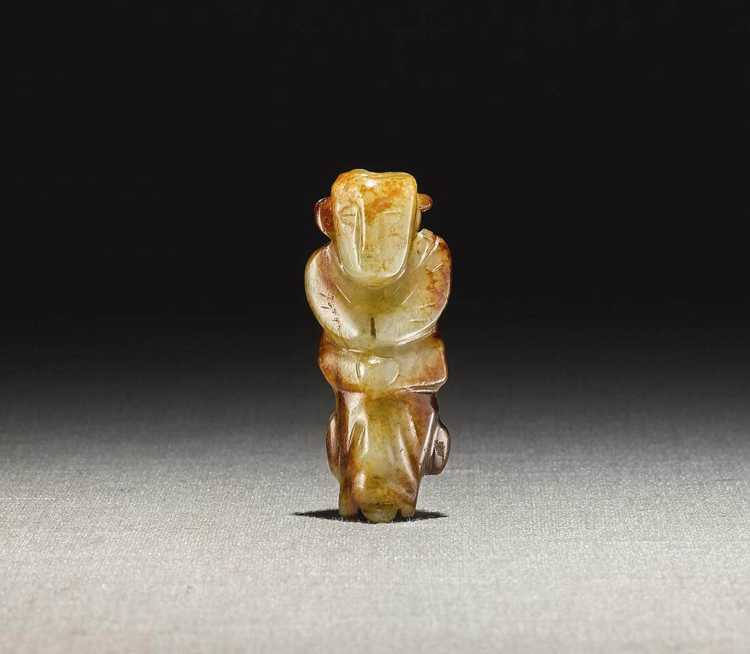 A Yellow and Russet Jade Figure