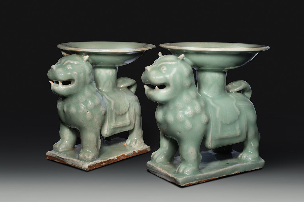 A Pair of Glazed Stoneware Lions Supporting Offering Dishes