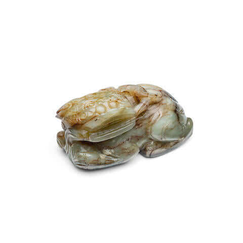 A Brown and Celadon Jade 'Lion' Carving